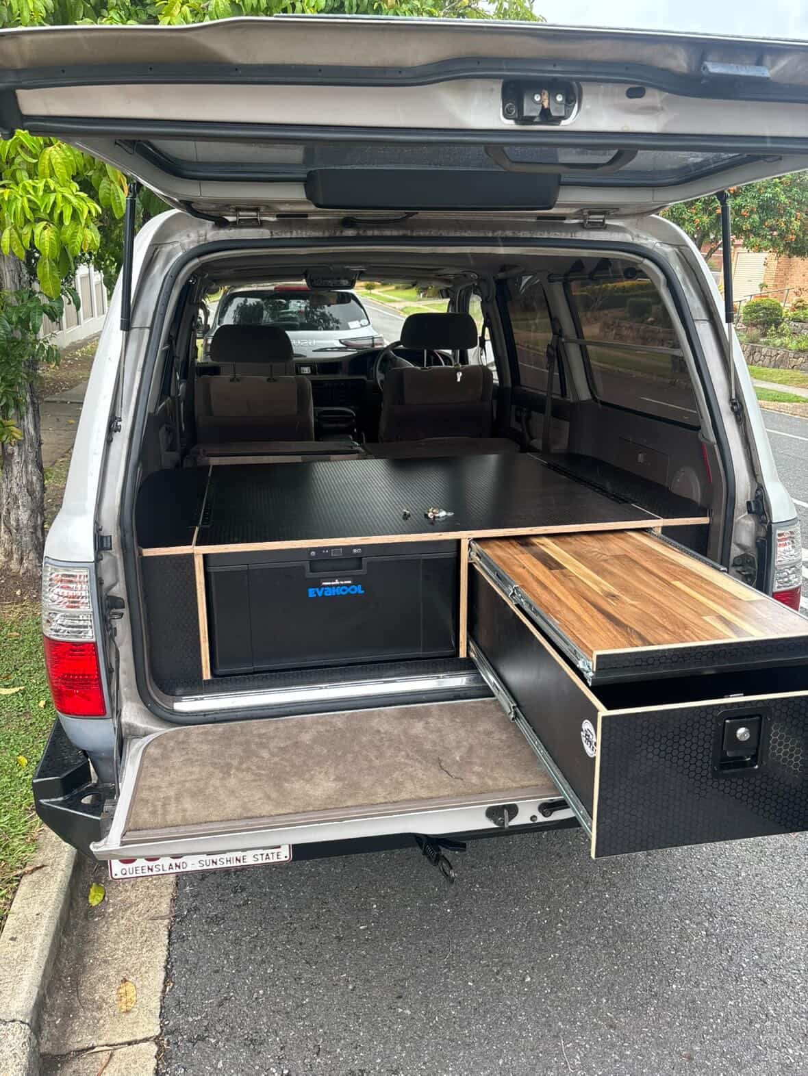 Toyota Prado drawer system with EvaKool fridge and timber pull-out work surface — custom 4WD cargo install by TAWL